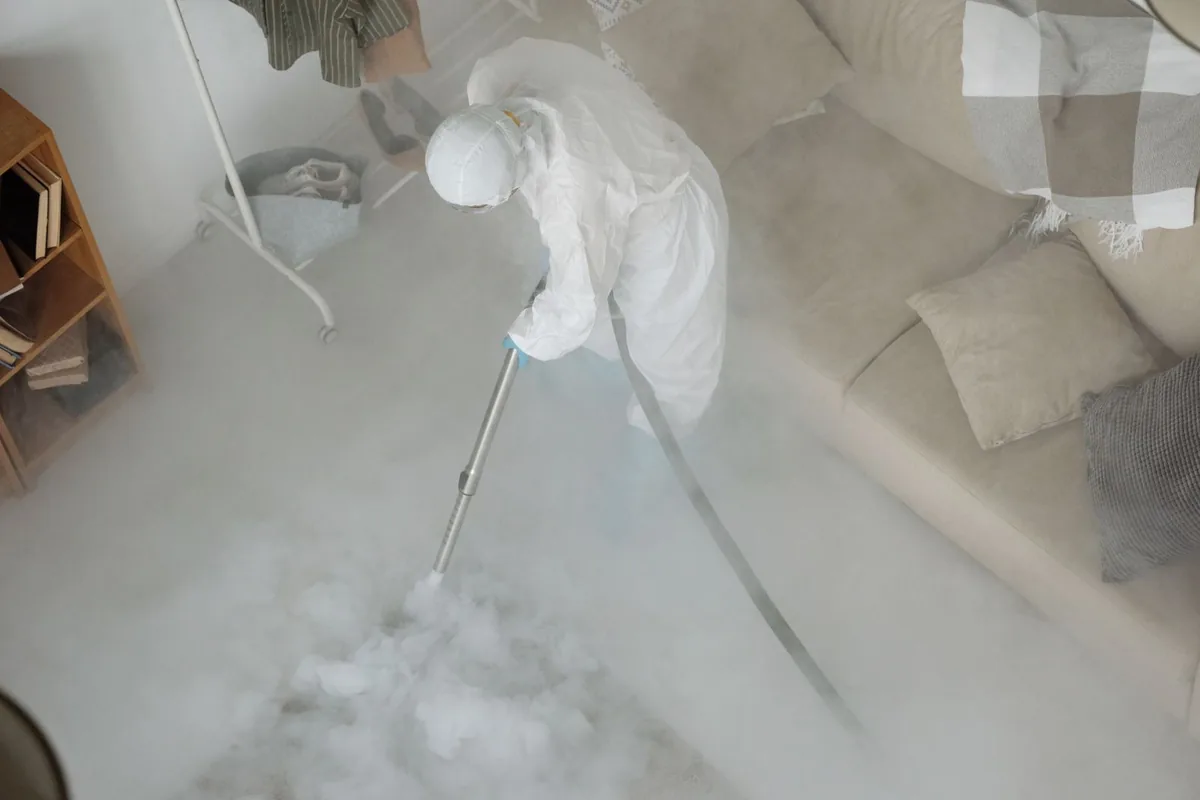 Biohazard cleanup technician in protective equipment, Hansville, WA